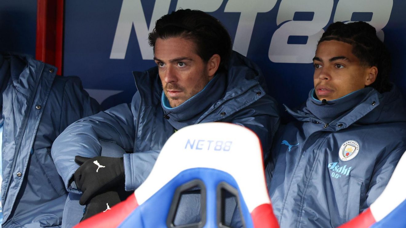 Man City winger Jack Grealish sits on the bench