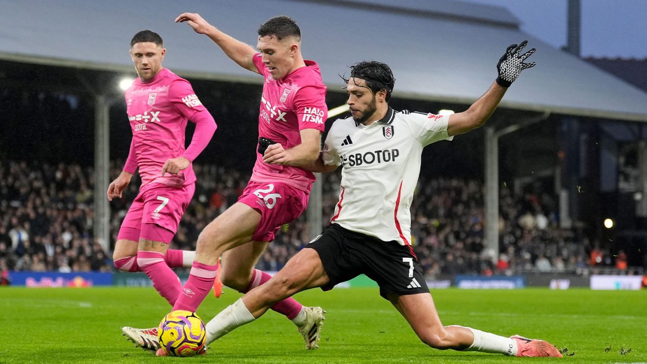 Fulham and Ipswich vie for the ball at Craven Cottage