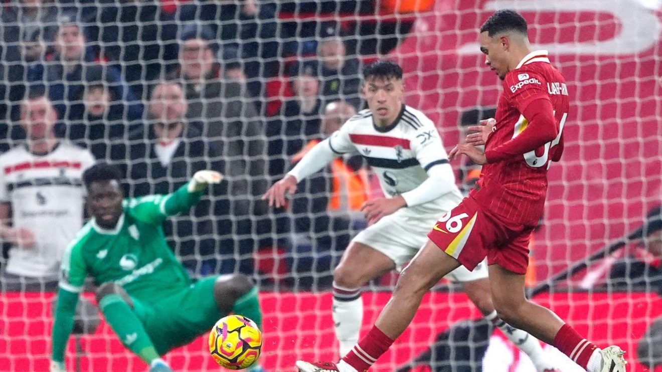 Liverpool defender Trent Alexander-Arnold shoots against Manchester United