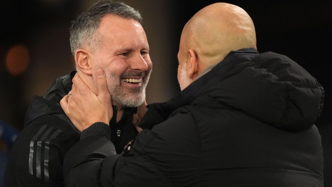 Man City v Salford: Ryan Giggs is embraced by Pep Guardiola