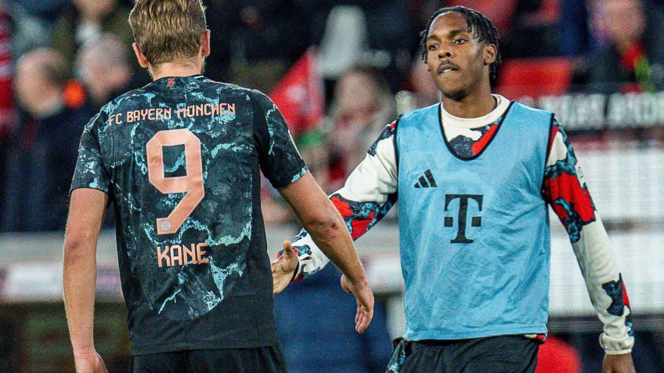 Chelsea and Man Utd target Mathys Tel shakes hands with Harry Kane