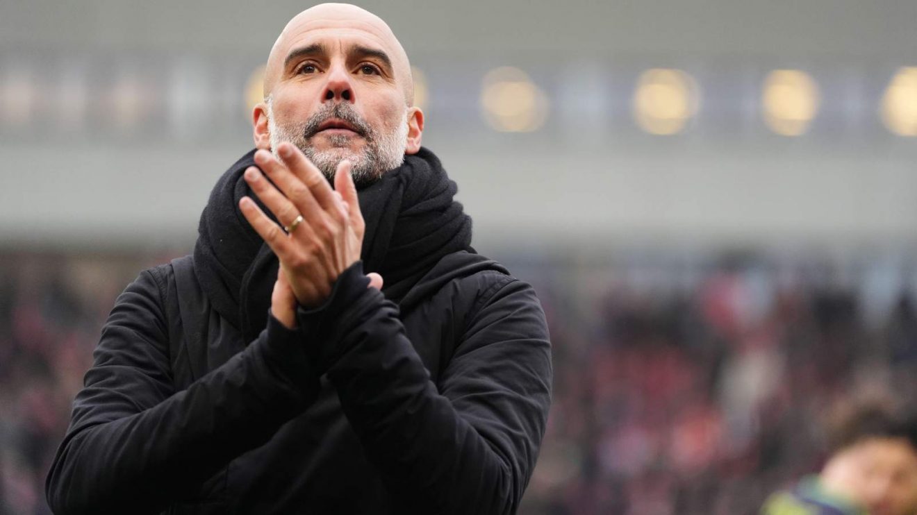 Man City manager Pep Guardiola applauds the fans