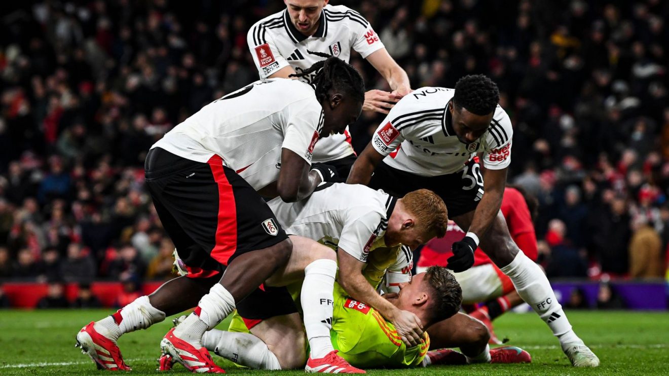 Bernd Leno is mobbed after Fulham beat Manchester United 4-3 on penalties in the FA Cup