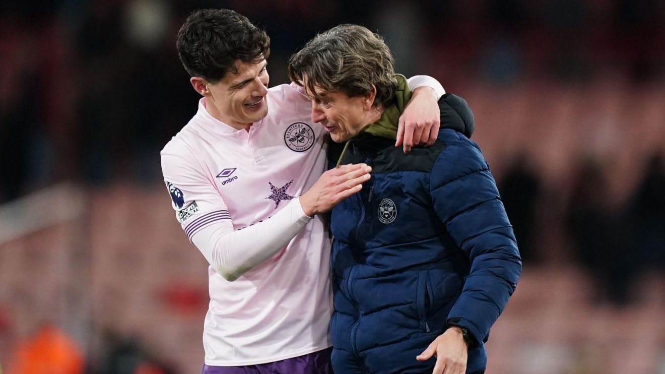 Brentford player Christian Norgaard with coach Thomas Frank