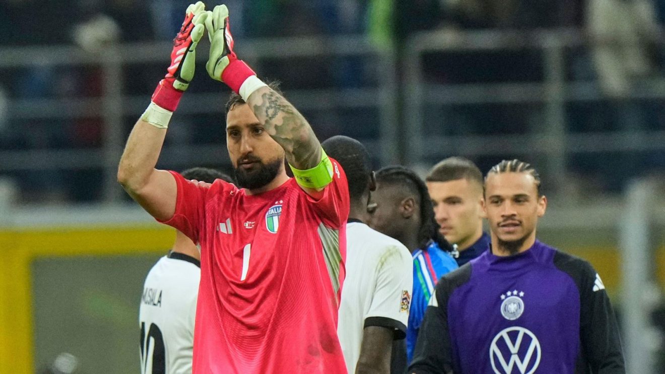 Gianluigi Donnarumma applauds fans at the San Siro