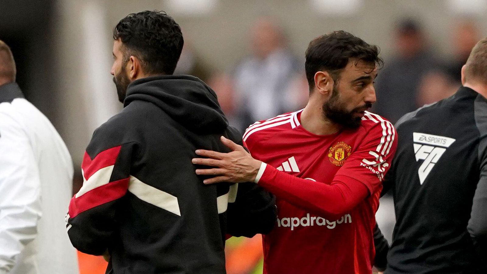 Manchester United manager Ruben Amorim embraces captain Bruno Fernandes