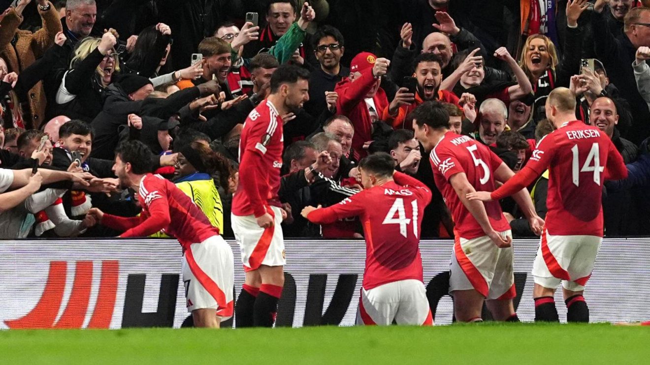 Man Utd players celebrate Harry Maguire's goal against Lyon