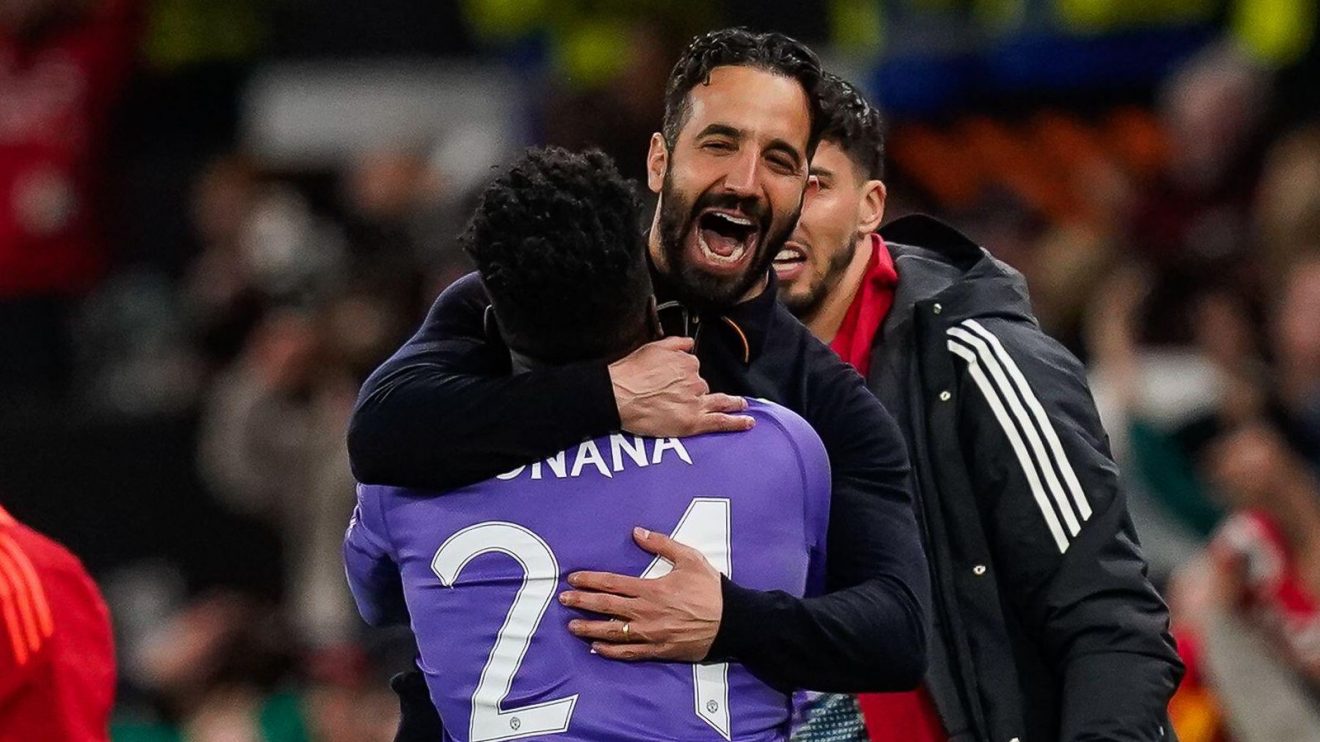Manchester United goalkeeper Andre Onana embraces manager Ruben Amorim