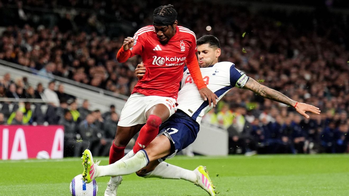 Nottingham Forest forward Anthony Elanga is tackled by Tottenham defender Cristian Romero