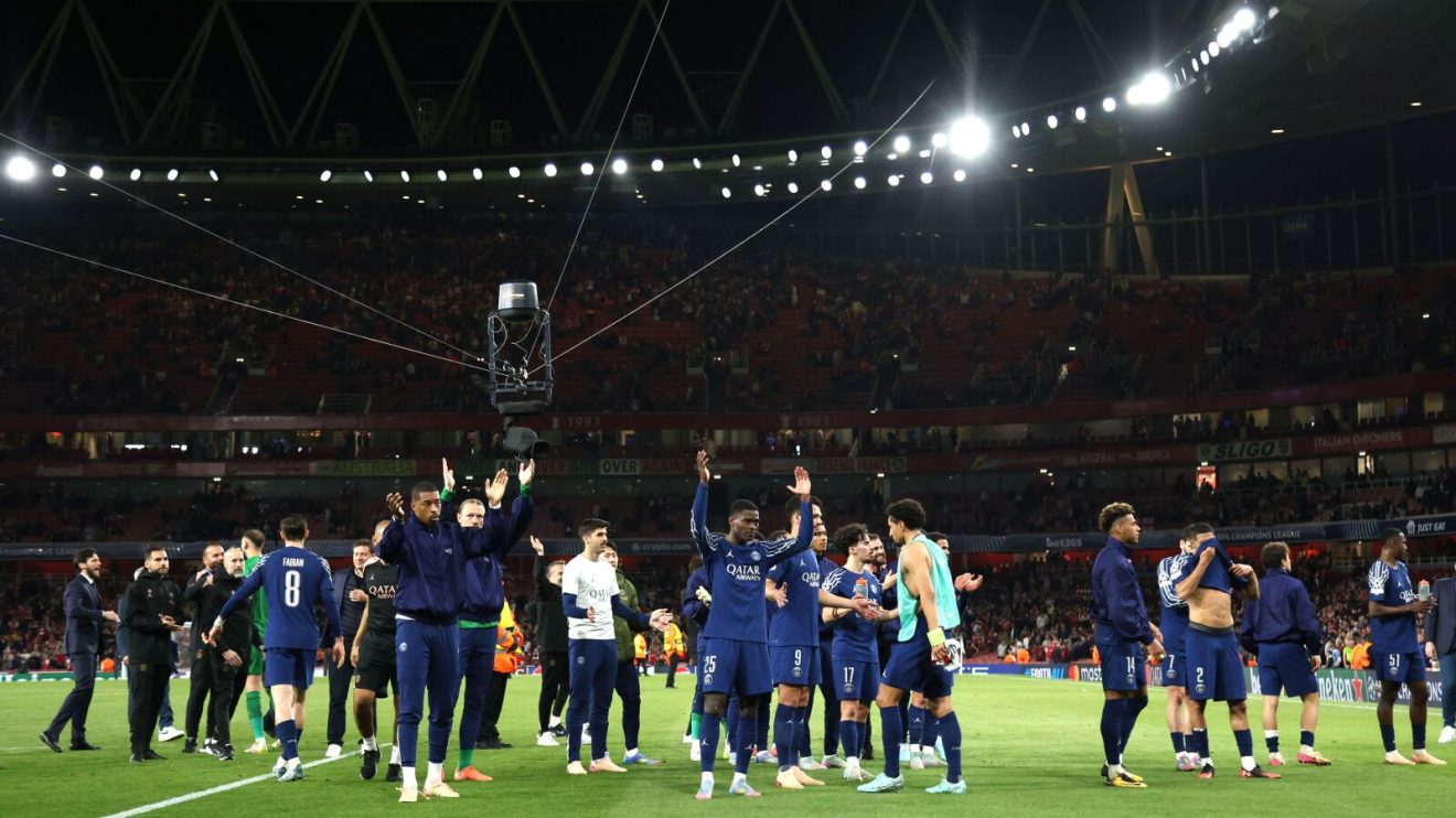 Paris St-Germain players celebrate after a 1-0 win over Arsenal at the Emirates