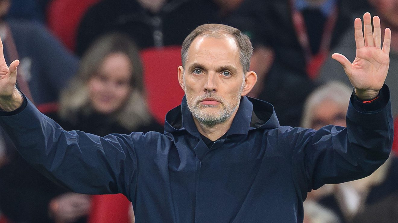 England manager Thomas Tuchel holds his hands up on the sidelines