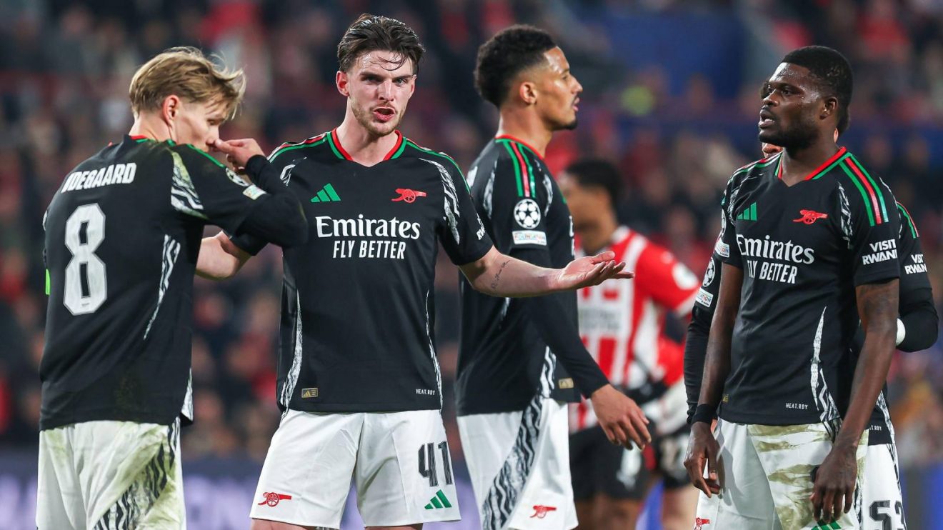 Arsenal midfielder Declan Rice tries to calm down his teammates