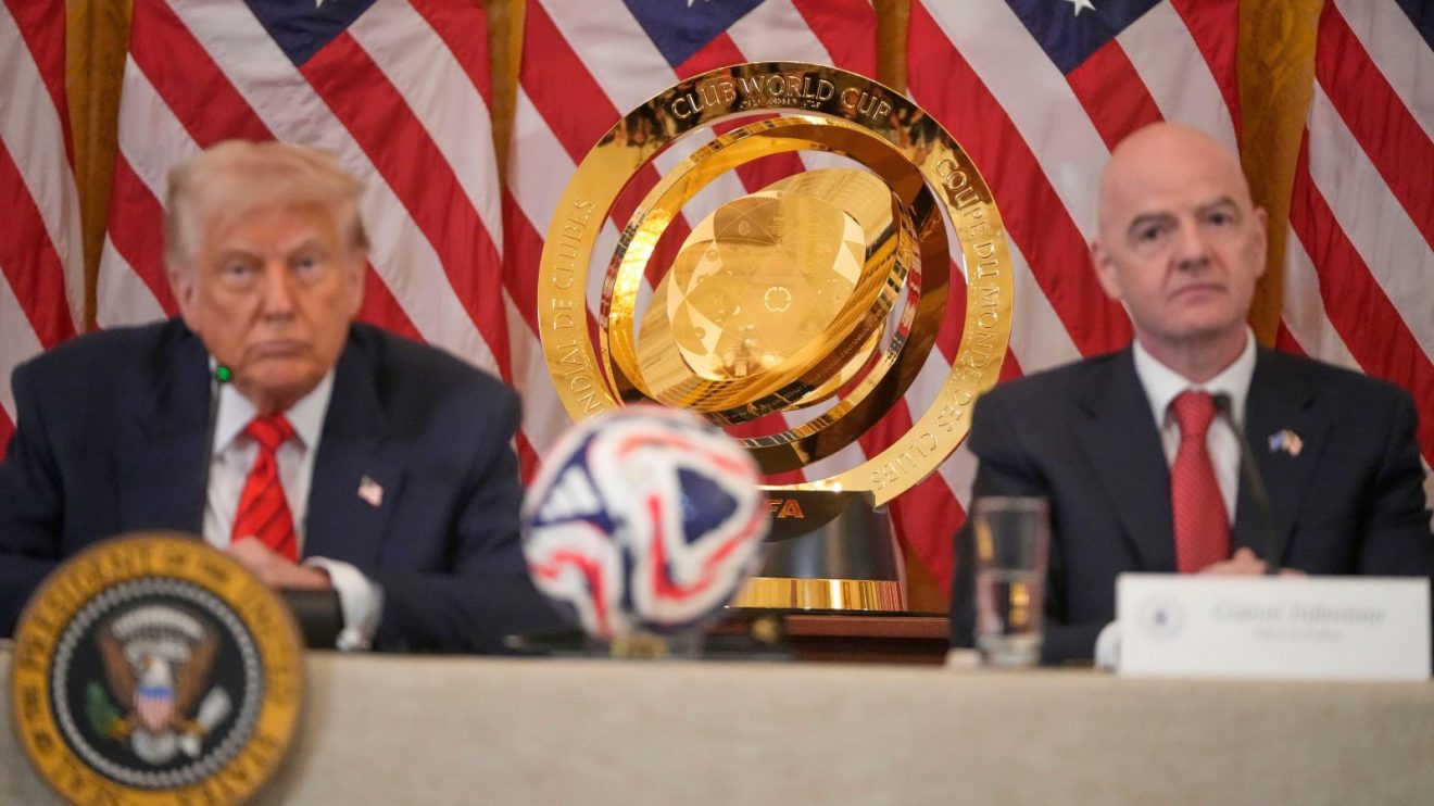 Club World Cup trophy between two dicks