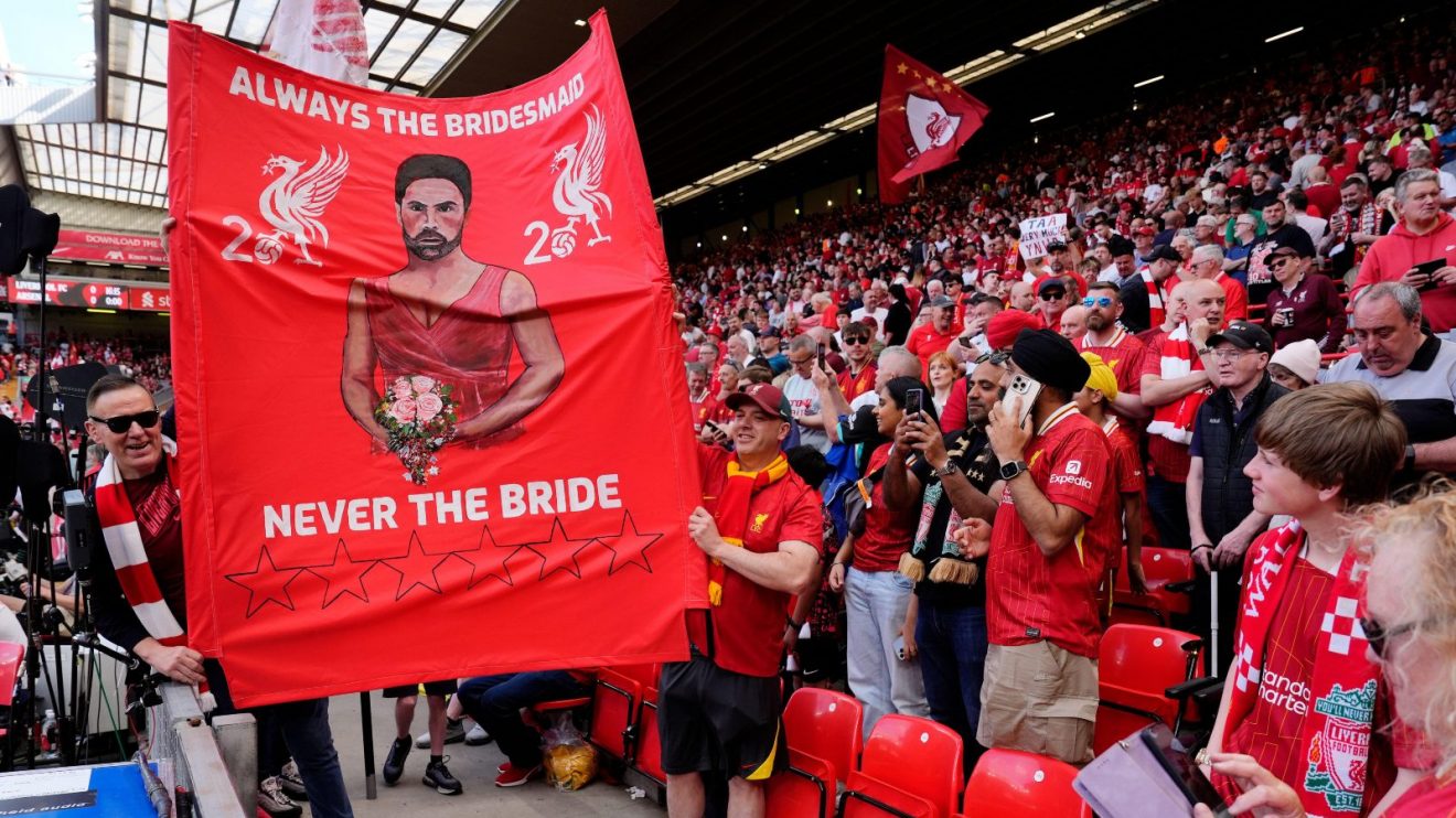 Liverpool fans hold up Mikel Arteta flag