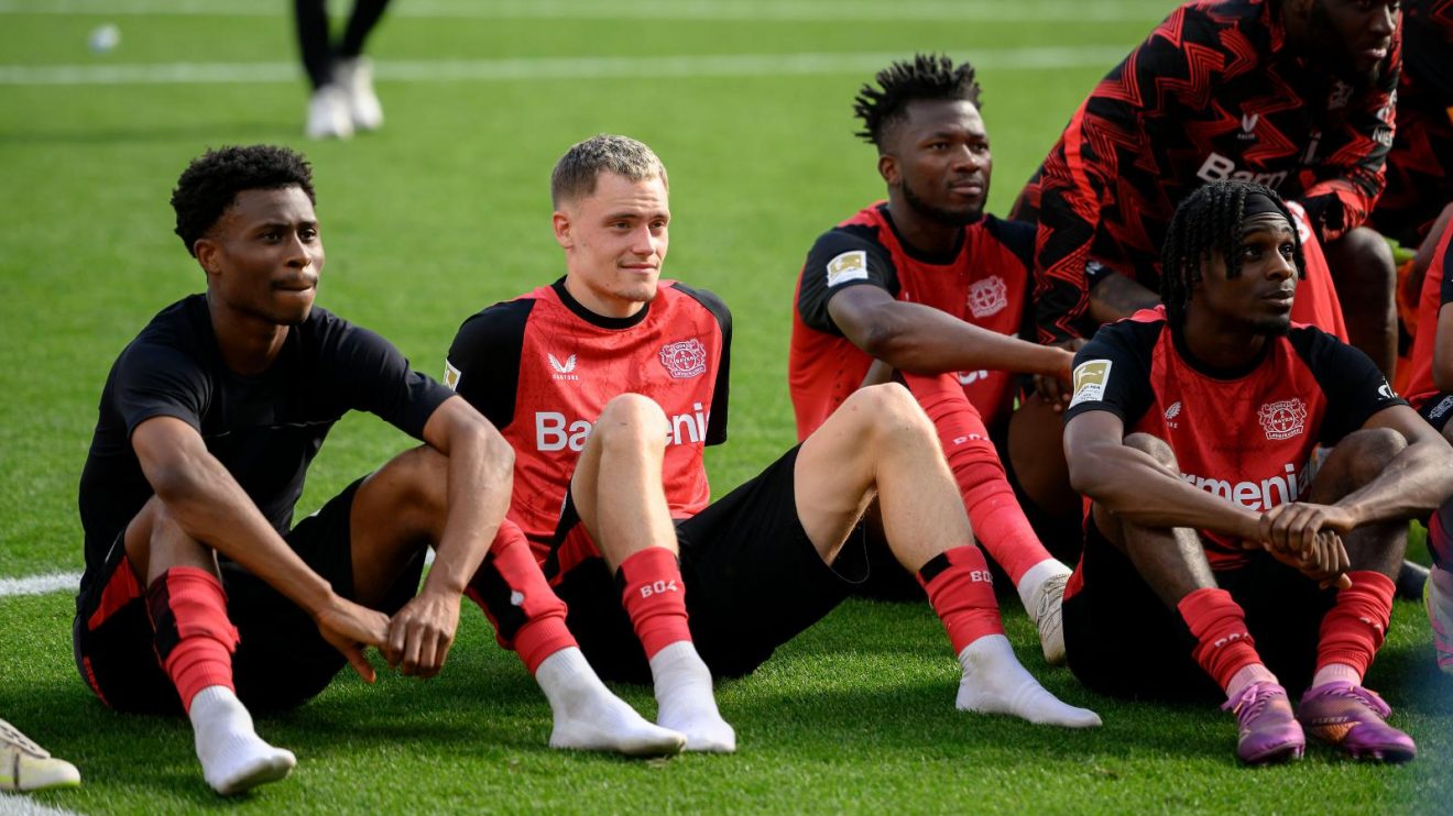 Liverpool transfer targets Jeremie Frimpong and Florian Wirtz sit in front of the fans