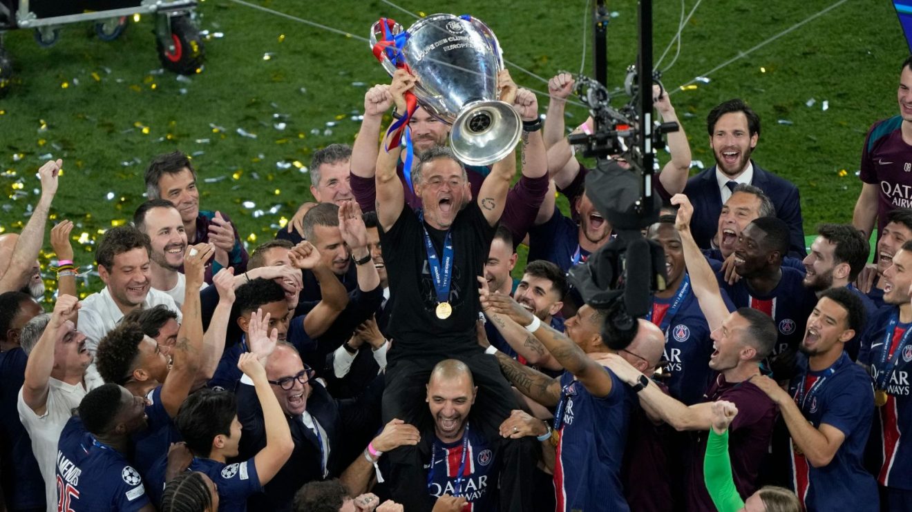 Paris Saint-Germain manager Luis Enrique celebrates with the Champions League trophy