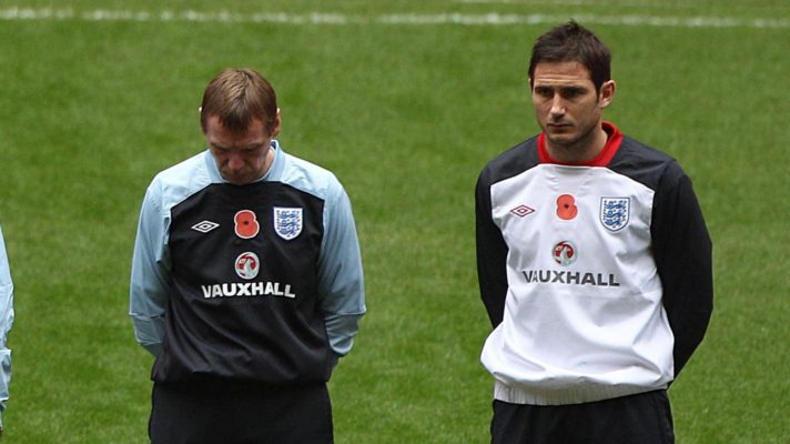 England coach Stuart Pearce and midfielder Frank Lampard observe a minute's silence