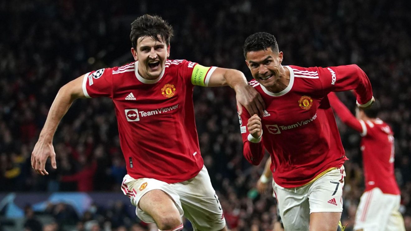 Man Utd players Harry Maguire and Cristiano Ronaldo celebrate