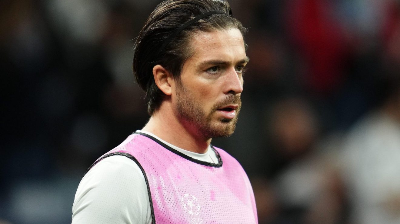 Jack Grealish warms up during a match