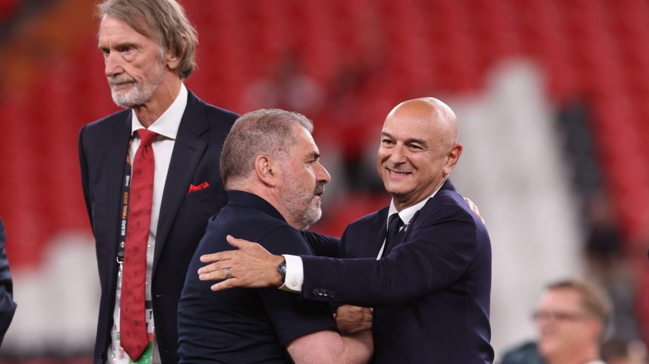 Ange Postecoglou shakes hands with Daniel Levy as Sir Jim Ratcliffe looks on