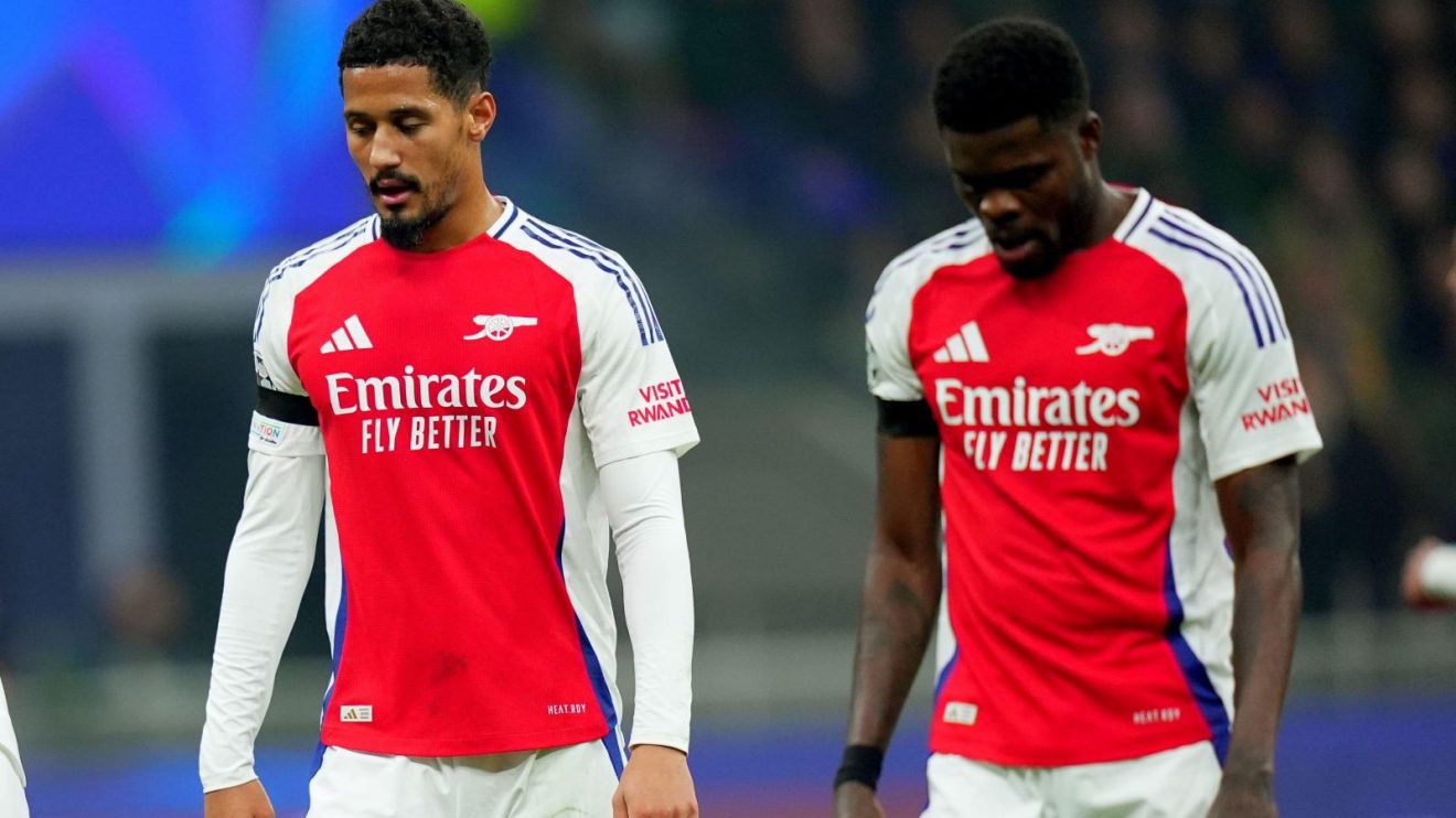 Arsenal players William Saliba and Thomas Partey look dejected after a defeat