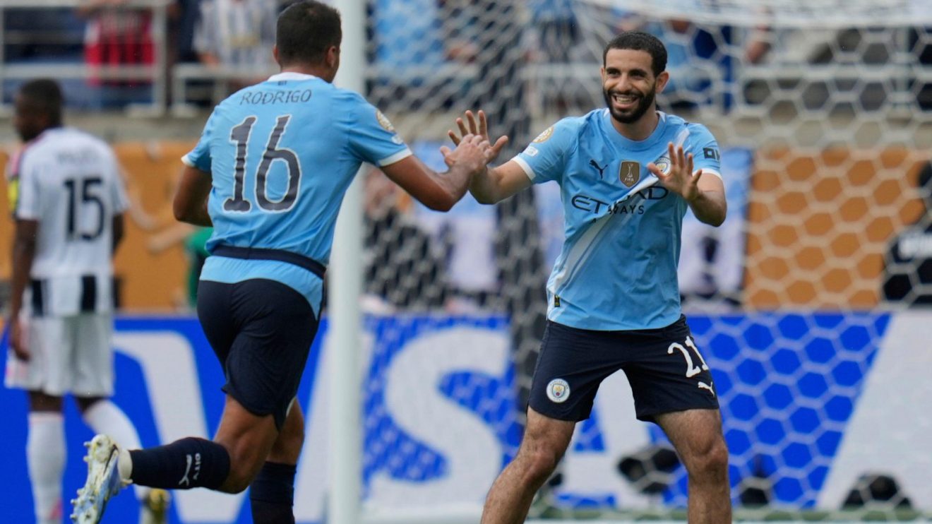 Man City defender Rayan Ait-Nouri celebrates with Rodri