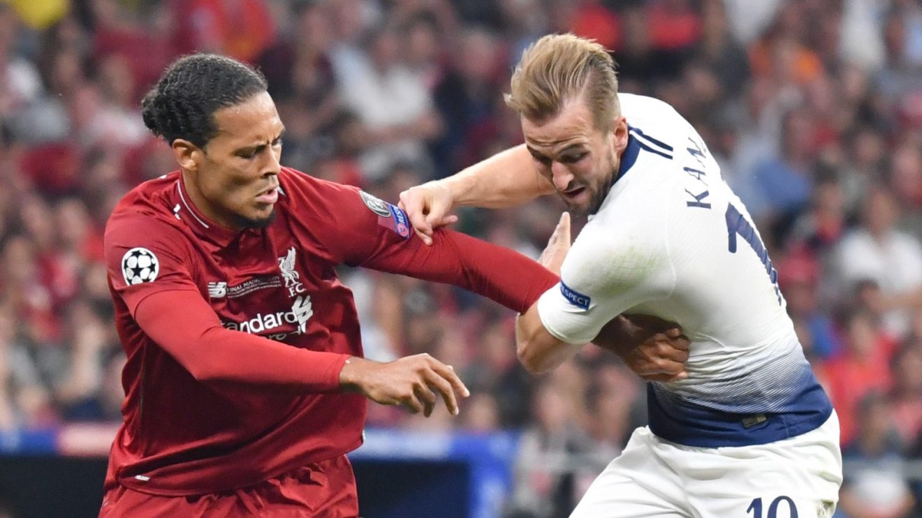 Liverpool defender Virgil van Dijk competes for the ball with Spurs striker Harry Kane