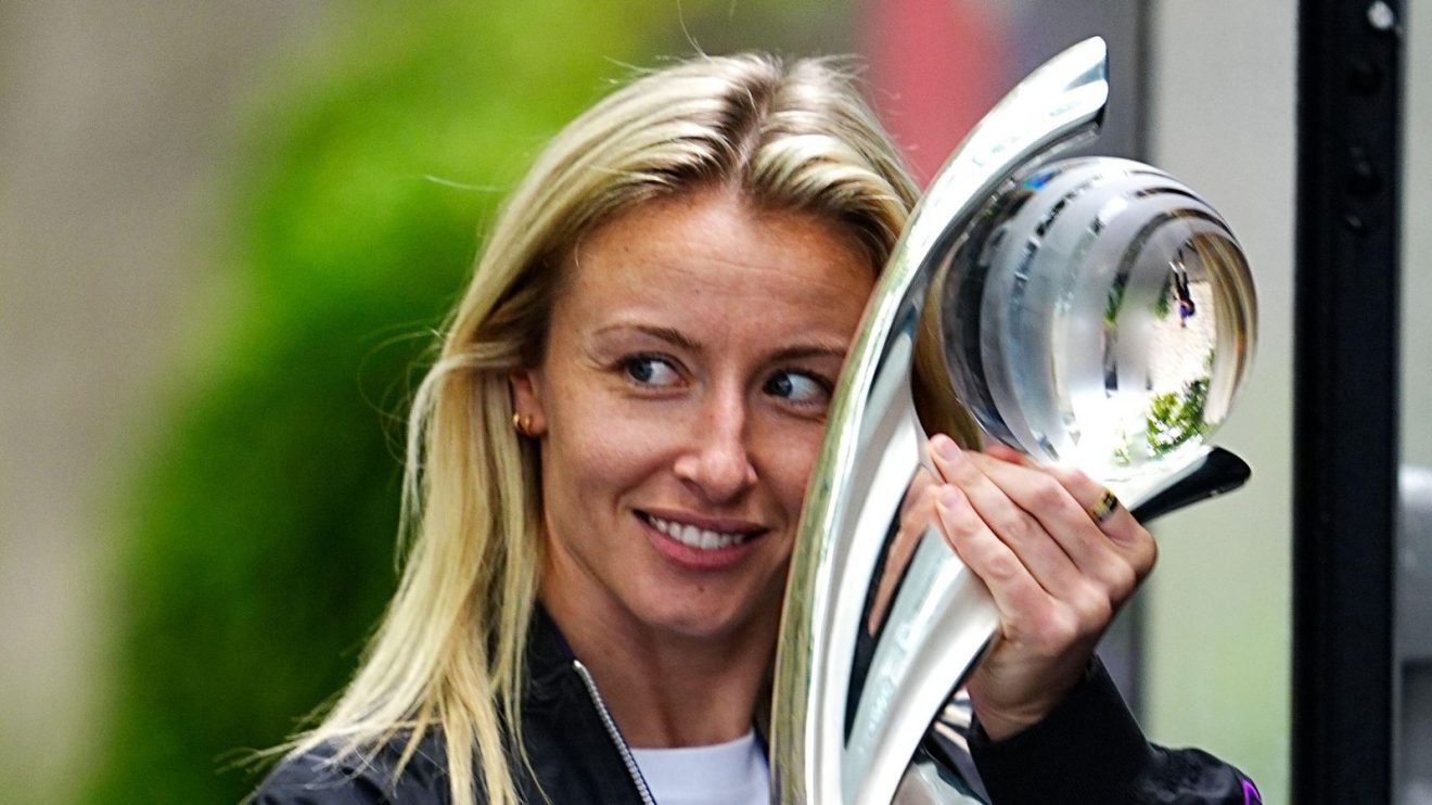 Leah Williamson cradles the Euro 2025 trophy
