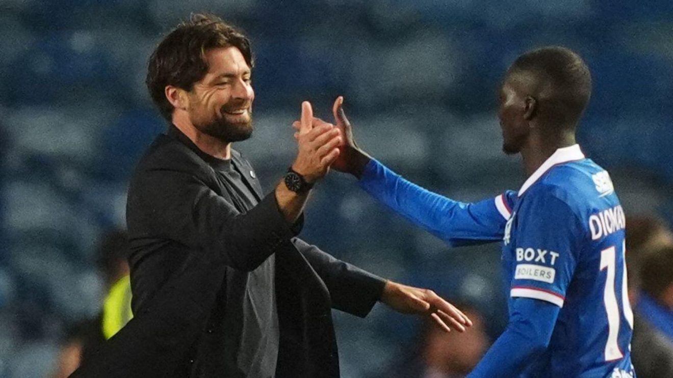 Rangers manager Russell Martin and Mohammed Diomande embrace