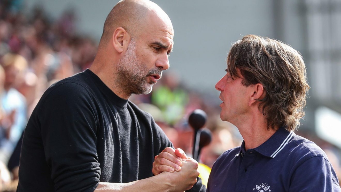 Man City manager Pep Guardiola shakes hands with Brentford's Thomas Frank
