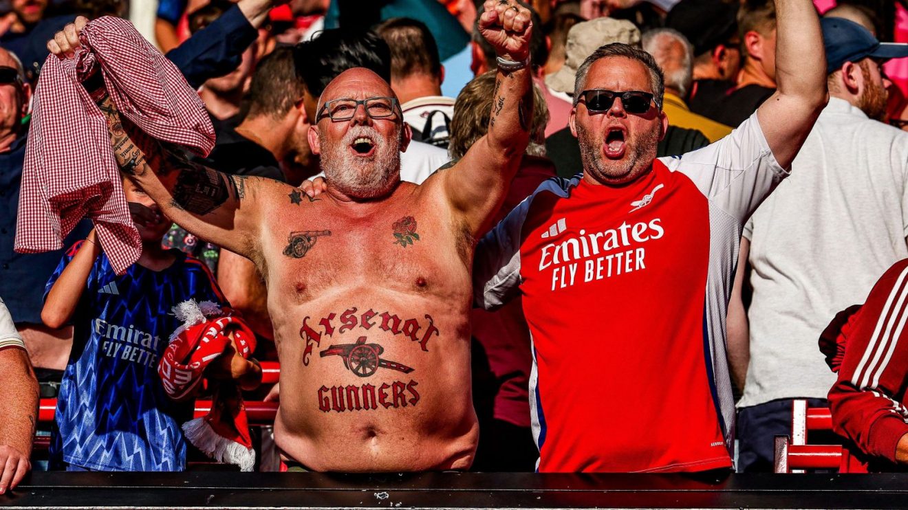 Arsenal supporters celebrate against Manchester United