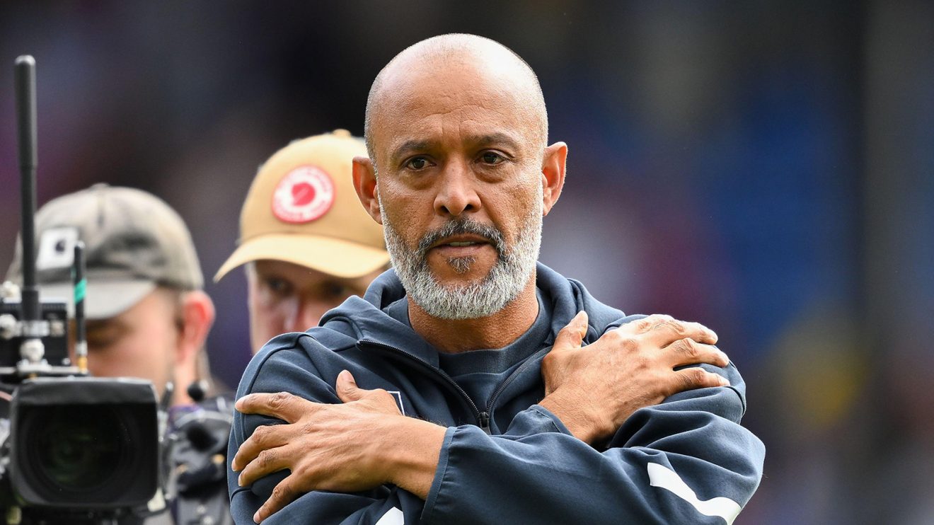 Nuno Espirito Santo stands with his arms crossed across his chest for some reason