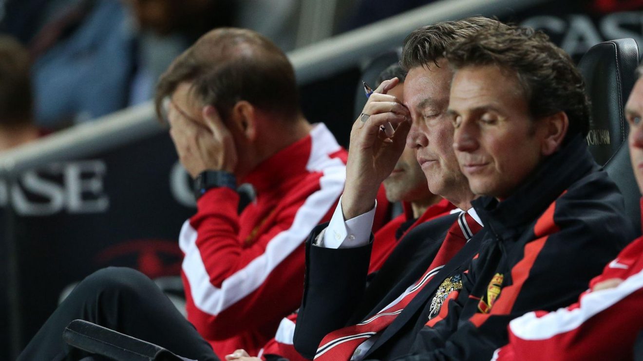 Louis van Gaal and Manchester United's coaches react against MK Dons