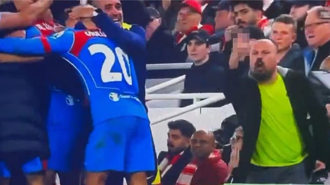 Liverpool fan goads Diego Simeone.