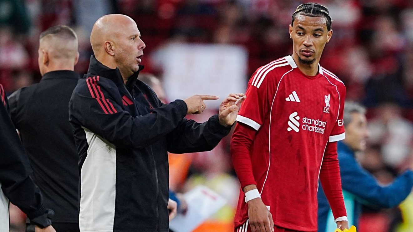 Liverpool boss Arne Slot gives instructions to Hugo Ekitike