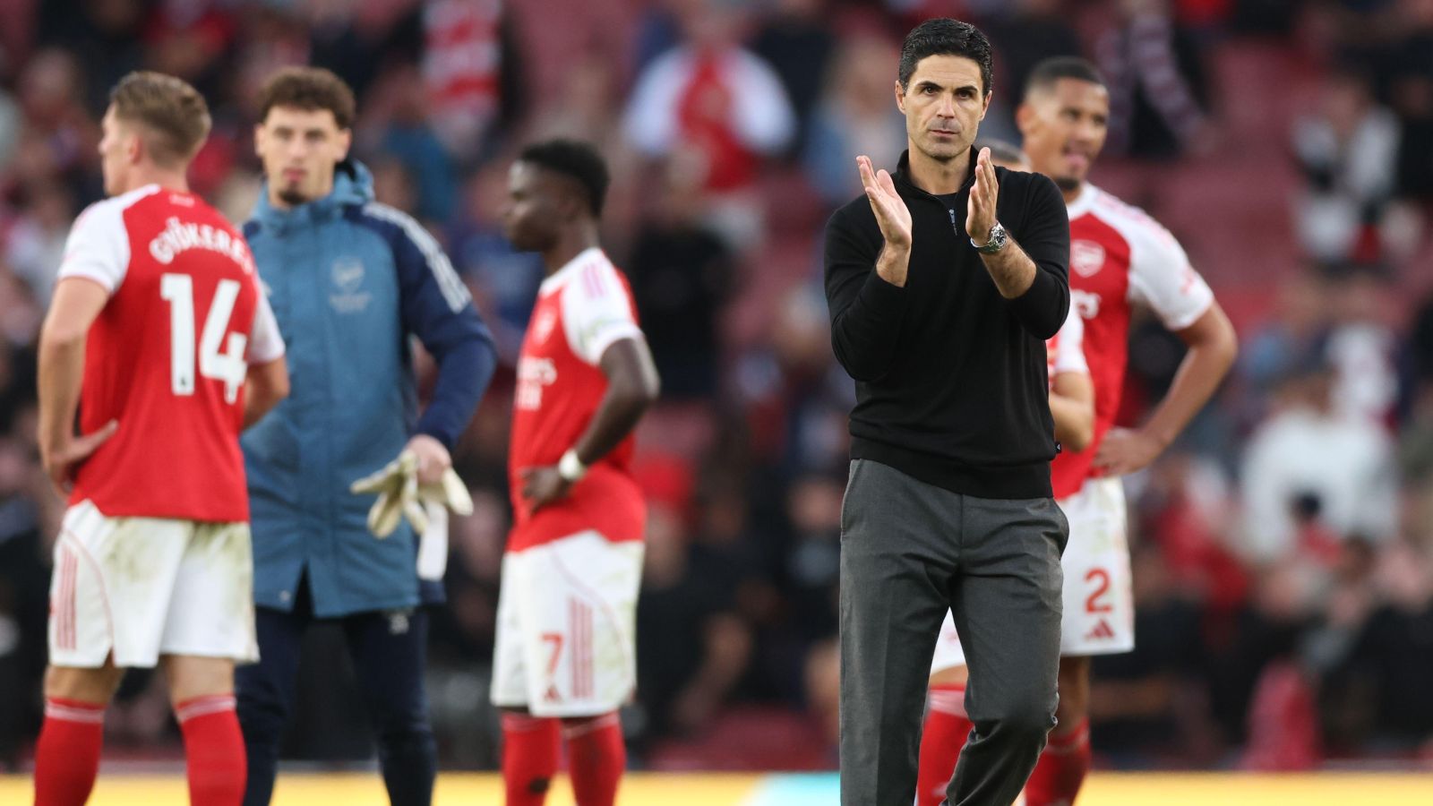Mikel Arteta with Arsenal players