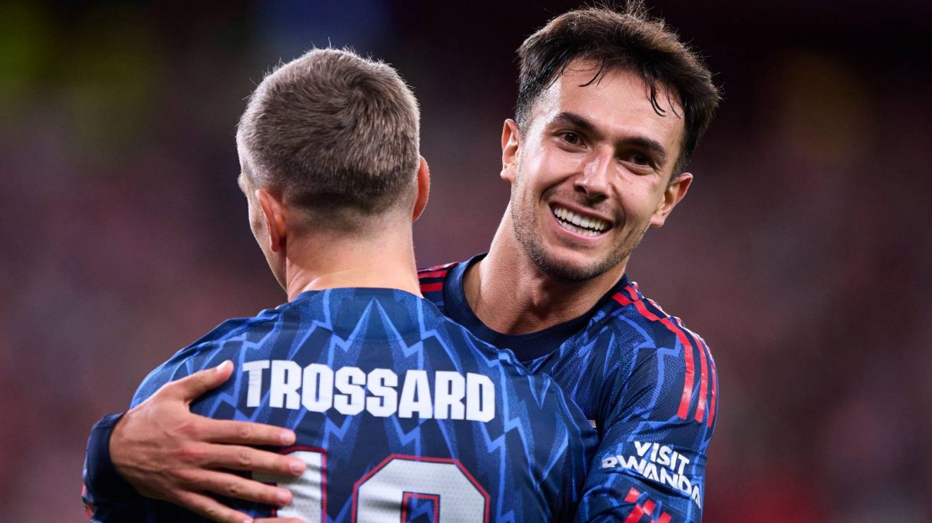 Arsenal midfielder Martin Zubimendi celebrates with Leandro Trossard