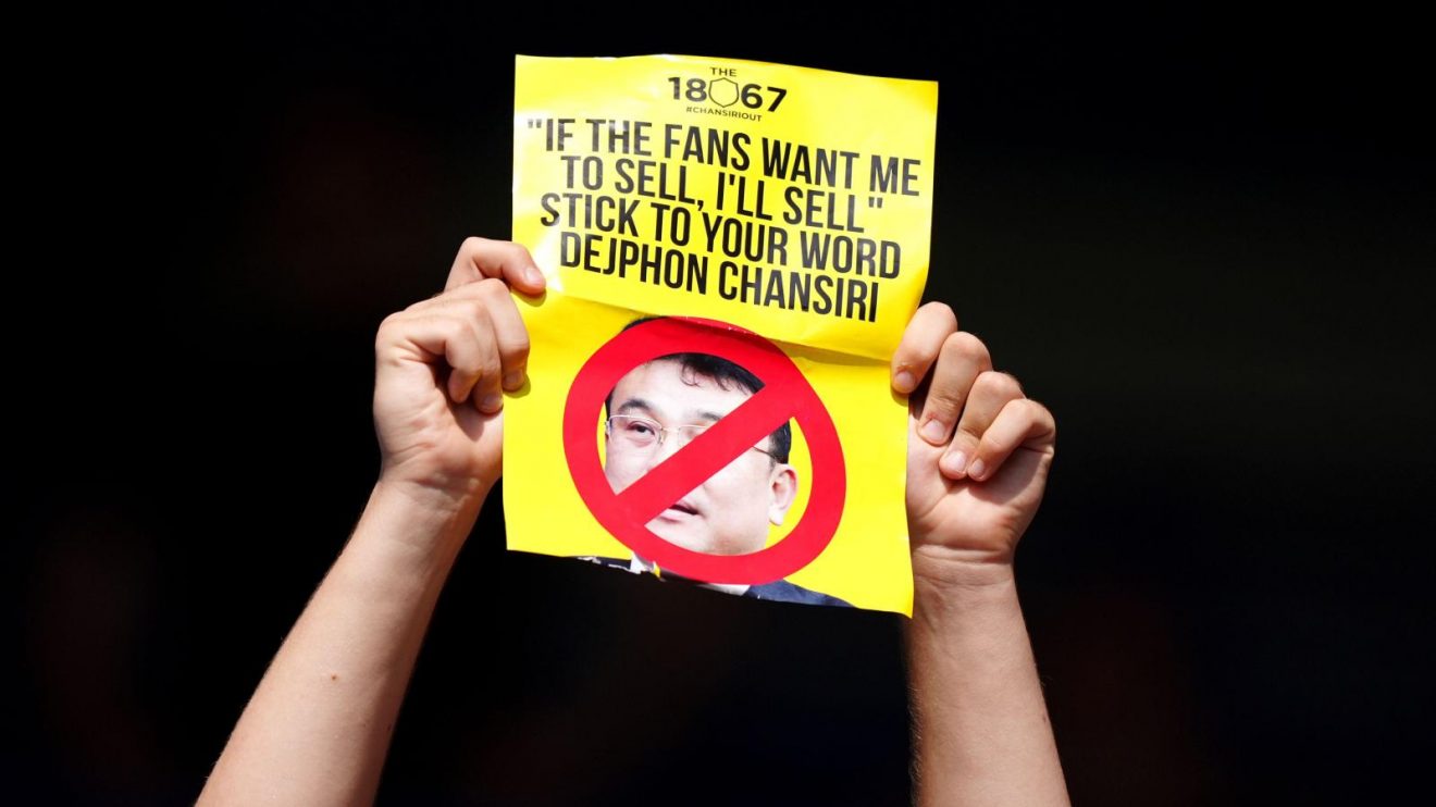 Sheffield Wednesday fans in the stands protest against club owner Dejphon Chansiri
