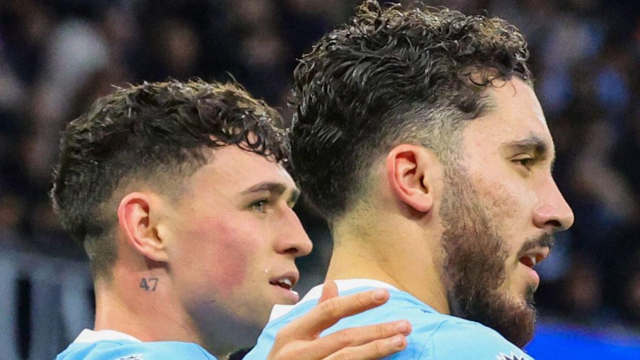 Manchester City players Phil Foden and Rayan Cherki celebrate against Sunderland
