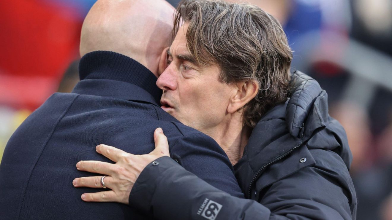 Spurs boss Thomas Frank hugs Liverpool head coach Arne Slot