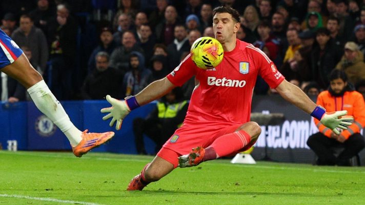 Emiliano Martinez makes a save at Chelsea.