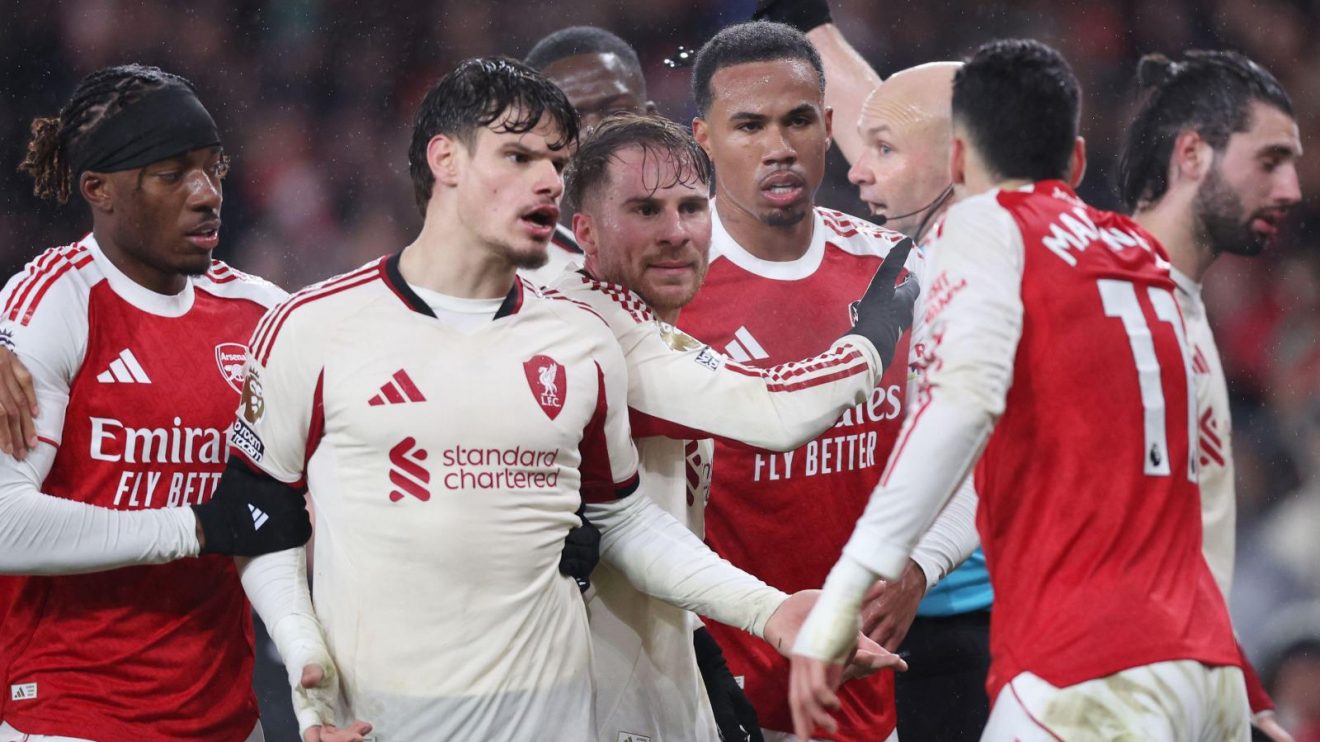 Arsenal winger Gabriel Martinelli is confronted by Liverpool players