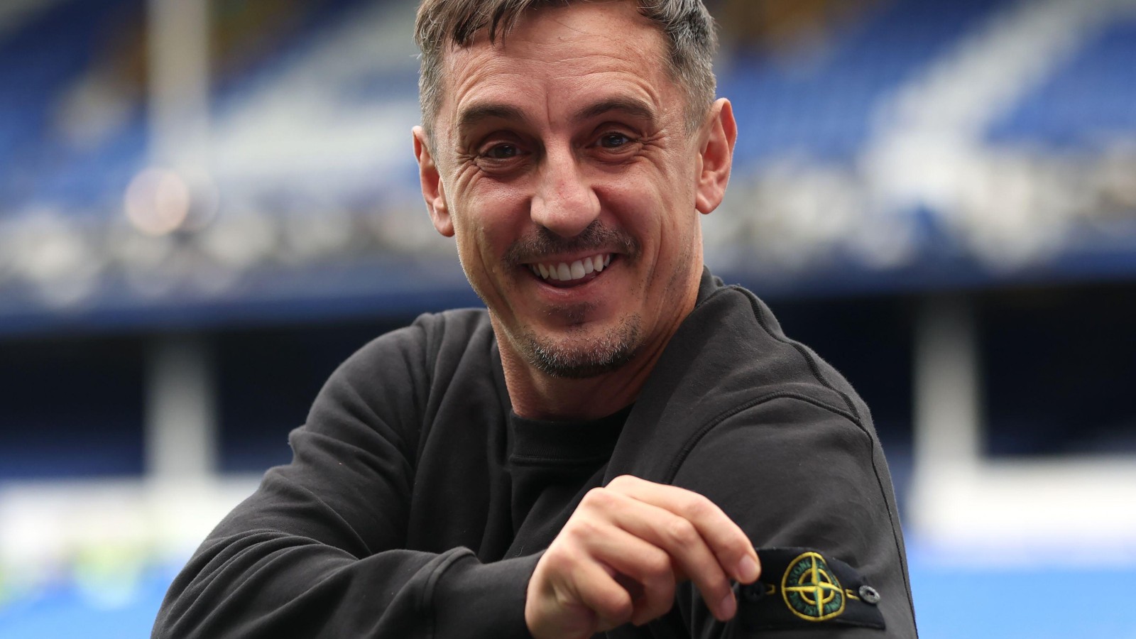 Sky Sports pundit Gary Neville gets the badge in