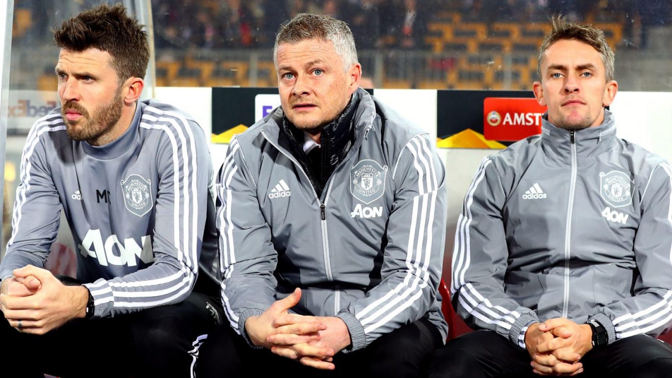 Michael Carrick (left) with Ole Gunnar Solskjaer (centre) and Kieran McKenna