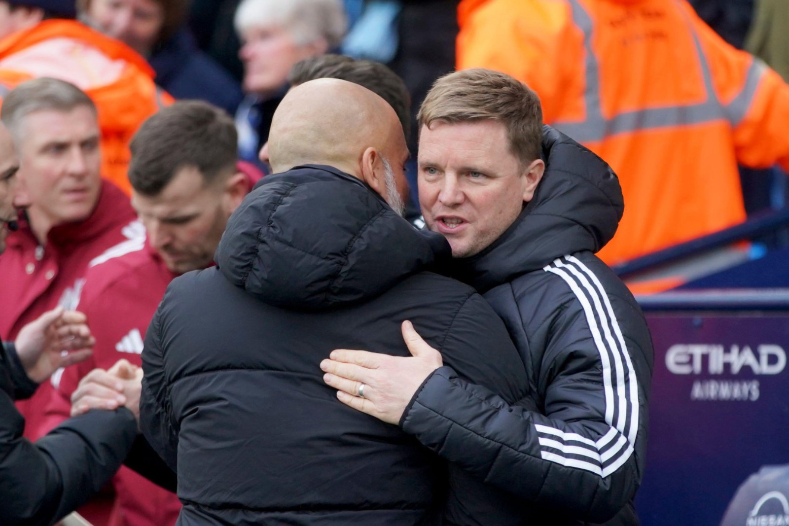 Pep Guardiola and Eddie Howe embrace