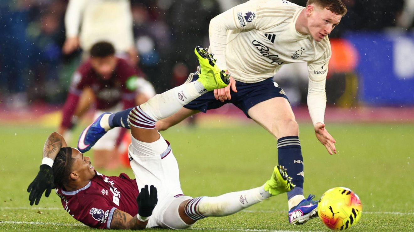 Elliot Anderson tackles Crysencio Summerville to win posession