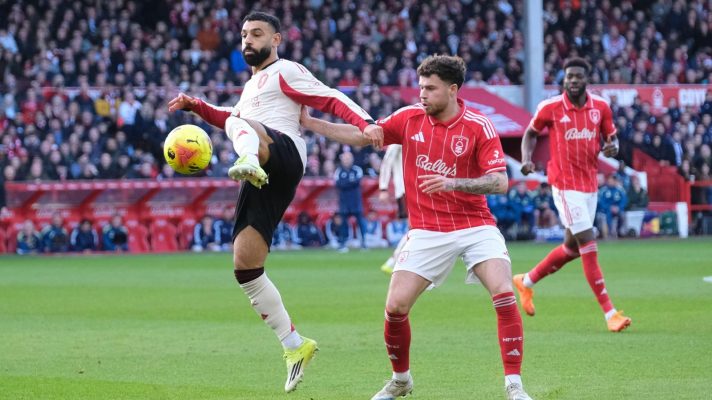 Mo Salah tries to control the ball under pressure from Neco Williams