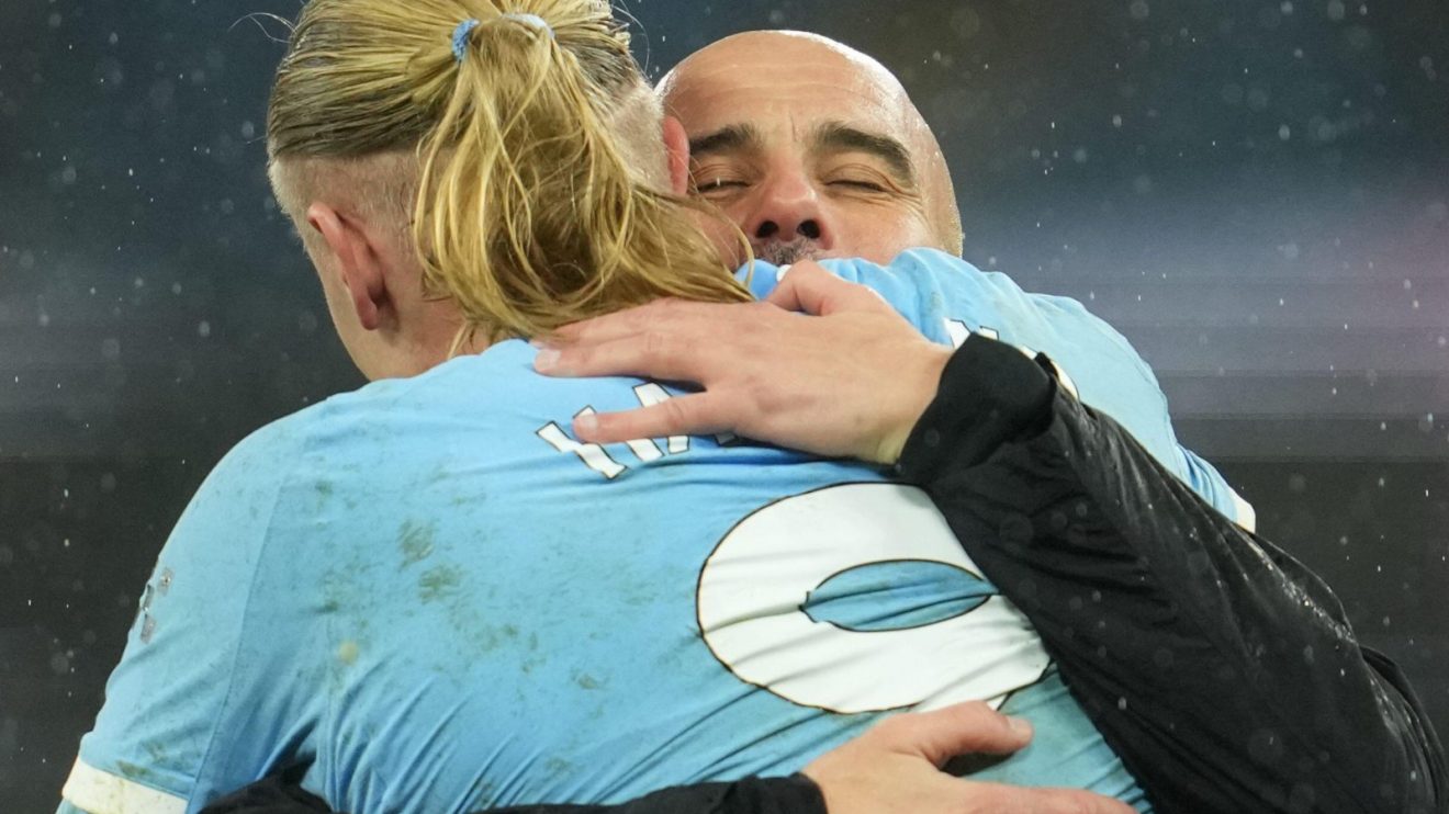 Man City manager Pep Guardiola celebrates with Erling Haaland