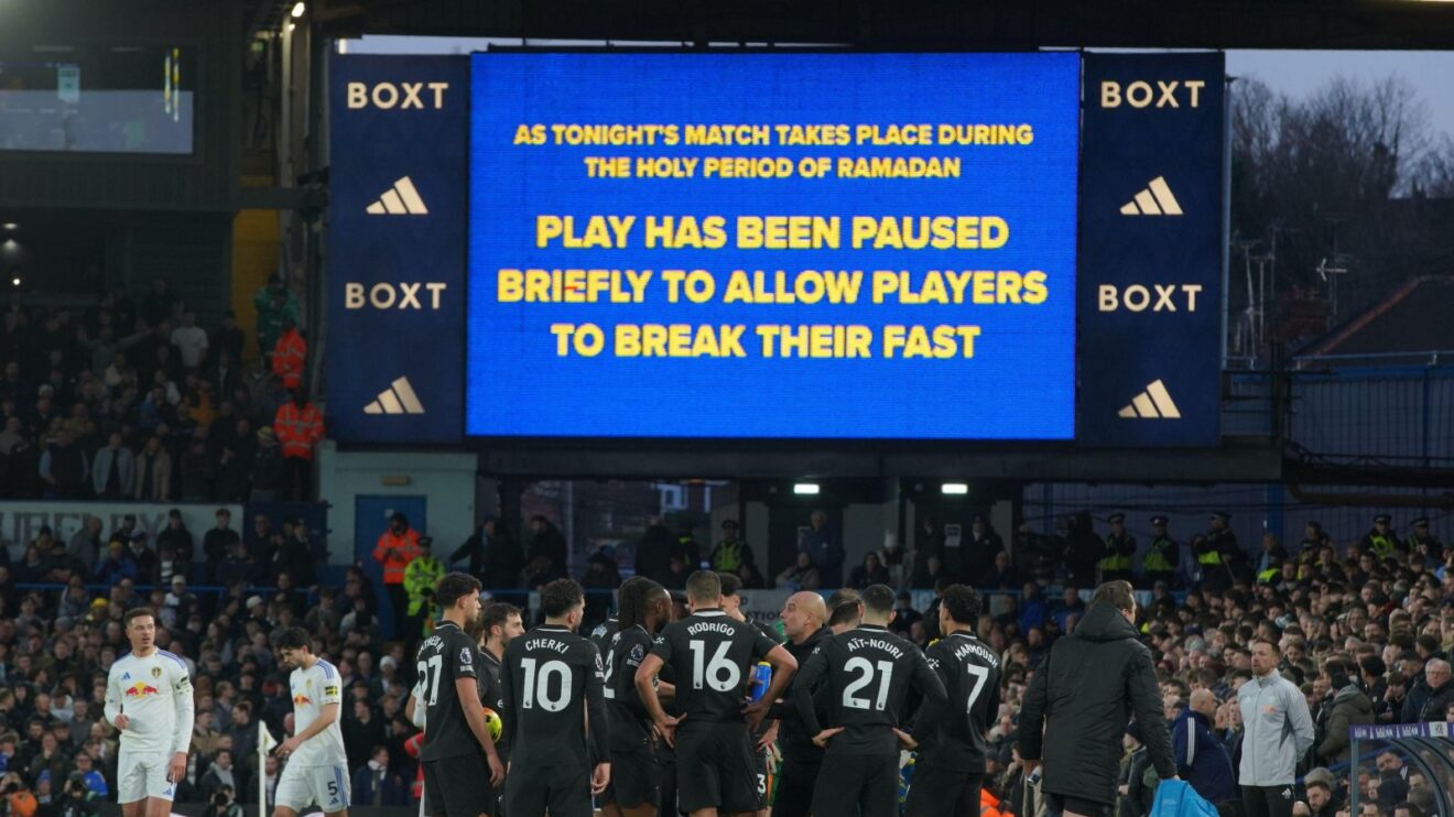 Players stand during a pause as observing Muslim players break the Ramadan fast during the Premier League soccer match between Leeds United and Manchester City in Leeds, England, Saturday, Feb. 28, 2026.