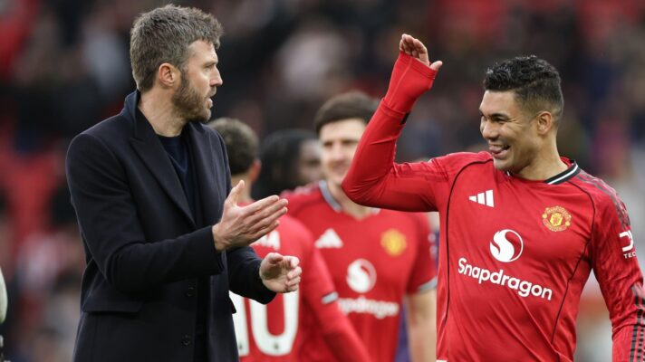 Michael Carrick celebrates with Casemiro after a Manchester United win.